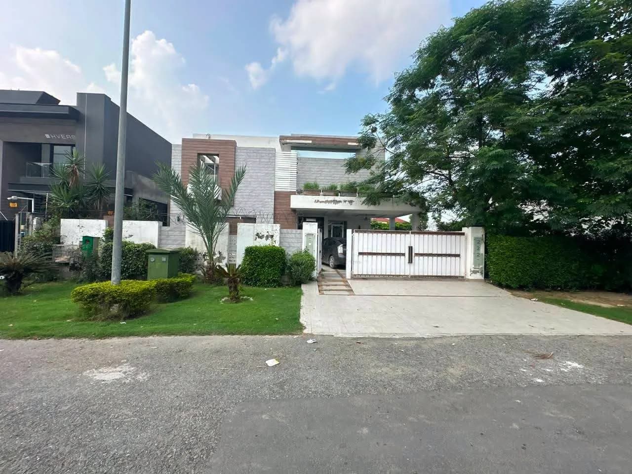 Prestige 1 Kanal Energy-Efficient Residence with 10kVA Solar System for Sale in DHA Phase 6, Lahore - Photo 1